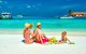 family playing on caribbean beach