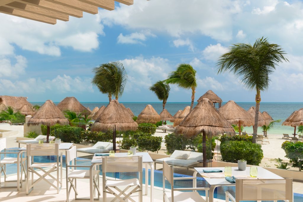 Beloved Playa Mujeres offers a serene beachfront sanctuary perfect for romance, where couples can unwind in total privacy while enjoying world-class amenities and pristine Caribbean views.