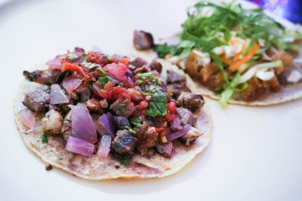 You will find small taquerías where the trompo spins and the smell of marinated pork fills the street, places like Taquería Honorio.