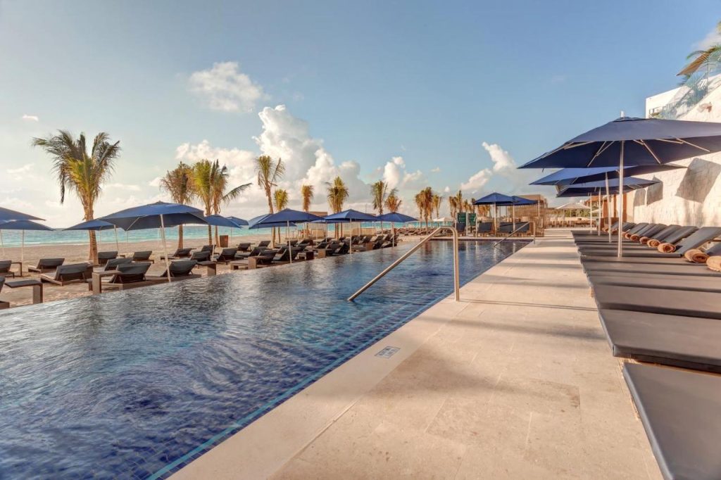 Discover the ultimate blend of party and style at Royalton CHIC Cancun, where glamorous poolside events and stylish oceanfront dining make every moment unforgettable, and then dance the night away under the stars at the vibrant Rooftop Cabana Lounge.