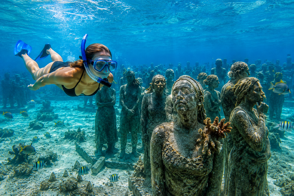 Cancun's MUSA is a really surreal underwater museum where life-sized statues slowly transform into a vibrant coral reef.